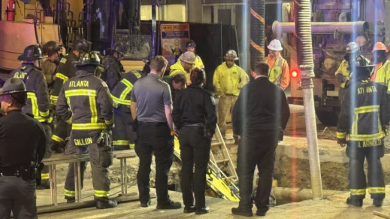 Atlanta construction worker falls in hole.